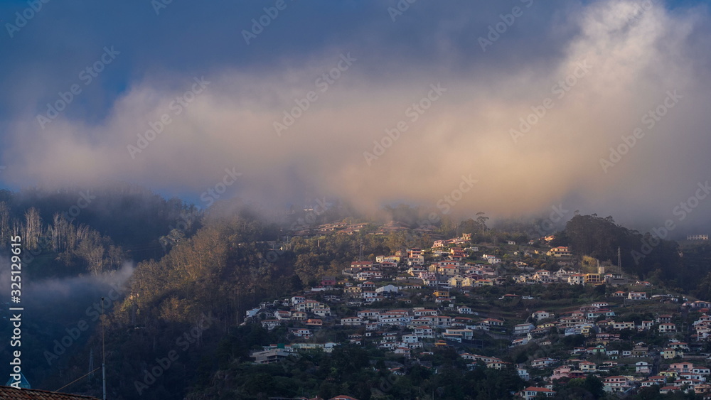 Sunset over houses on hill in Funchal, Madeira, Portugal timelapse
