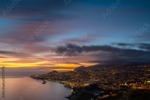 Funchal with a long exposure during a colorful sunset © Penteas