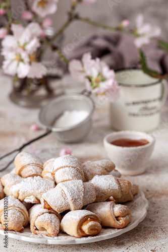 Shortbread rolled cookies filled with apricot jam