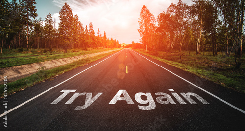 Konstfotografi Try Again written on highway road in the middle of empty asphalt road at  beautiful blue sky