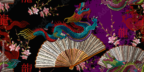 Asian colorful dragons, rising sun, japan fan and sakura flowers. Template for clothes. Hieroglyph dragon. Ethnic horizontal seamless pattern. Oriental art. Fashion japanese and chinese style
