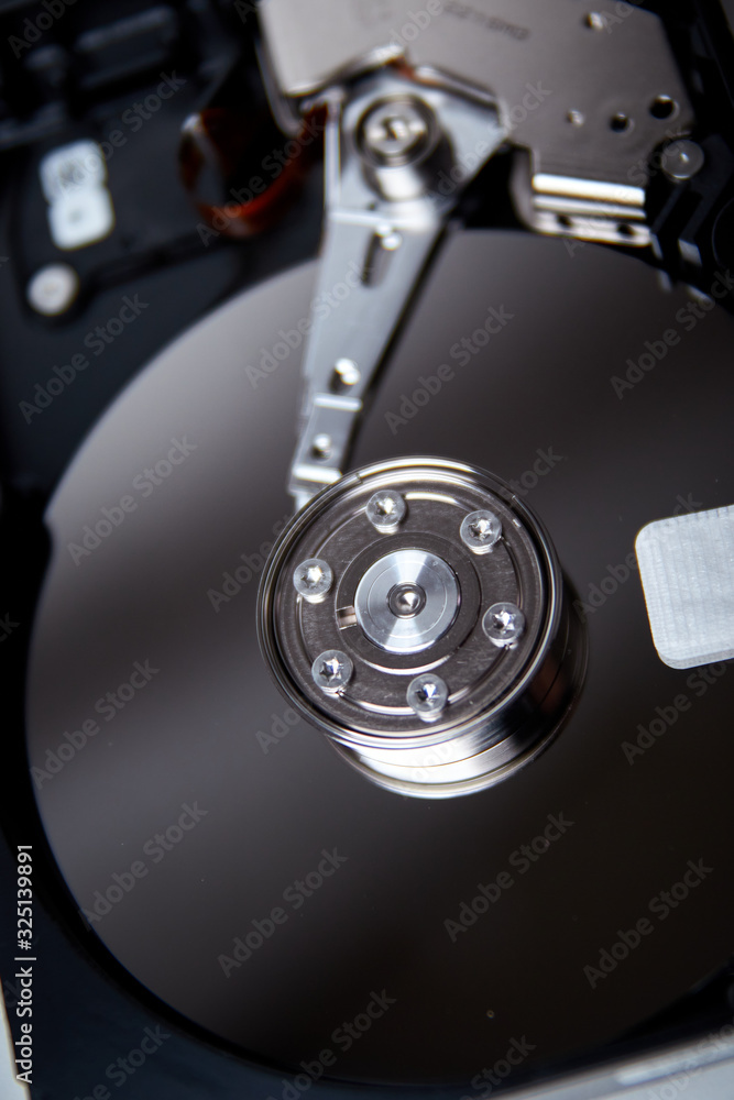 Opened hard drive from the computer hdd disk drive Opened hard drive from the computer hdd disk drive