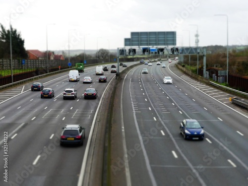 Tilt shift photograph of traffic on the M25 London Orbital Motorway between Junction 17 and Junction 18 in Hertfordshire, UK