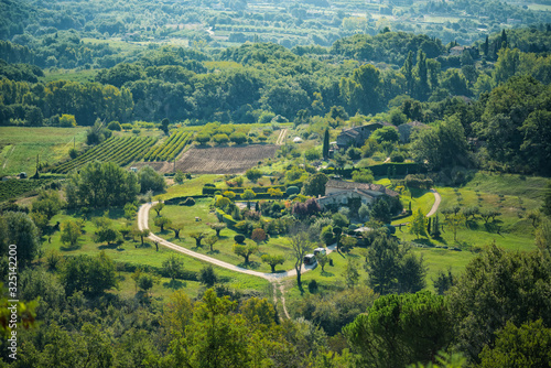 Scenic amazing view from one of the most beautiful villages of France Gordes of Luberon valley in Provence, France. Sunny day, green hills and vineyards. Rural provencal landscape. Travel tourism.