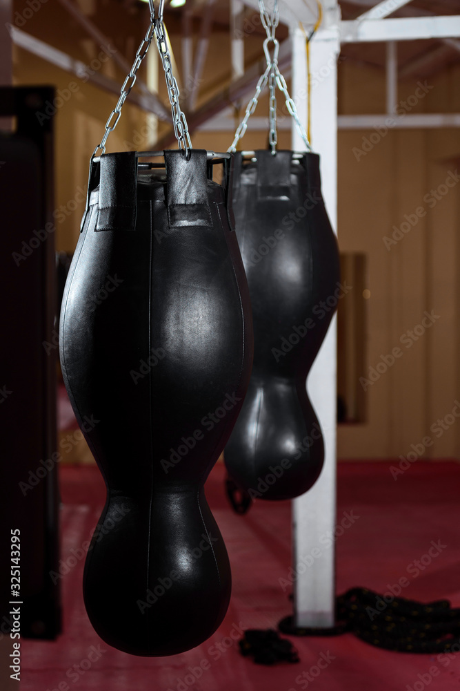 punching boxing bag in the sport gym