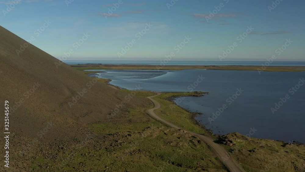 Cinematic aerial forward shot of road overflying Icelandic coast Cinematic aerial forward shot of road overflying Icelandic coast