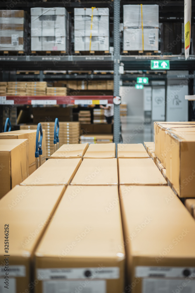 Stack of cardboard boxes in smart warehouse industry logistic.