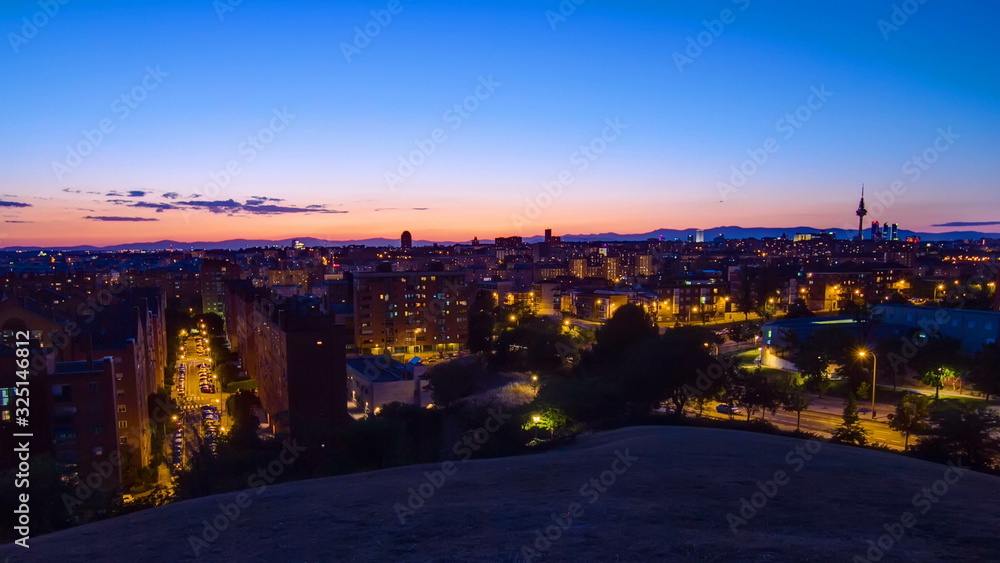 Panoramic day to night timelapse View of Madrid, Spain. Photo taken from the hills of Tio Pio Park, Vallecas-Neighborhood.