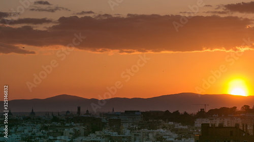Sunset over the city timelapse View of Madrid, Spain. Photo taken from the hills of Tio Pio Park, Vallecas-Neighborhood.
