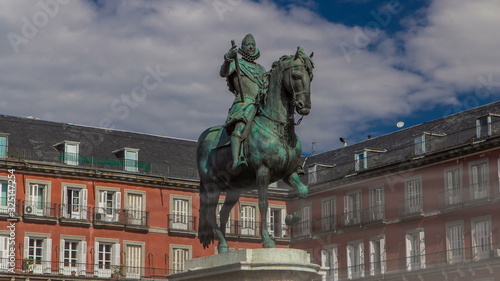Statue of Philip III timelapse hyperlapse at Mayor plaza in Madrid in a beautiful summer day, Spain