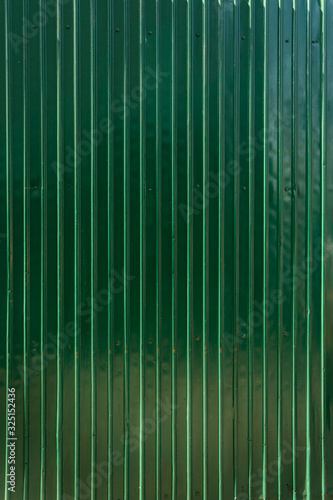 green shiny shutter metal wall background with text space