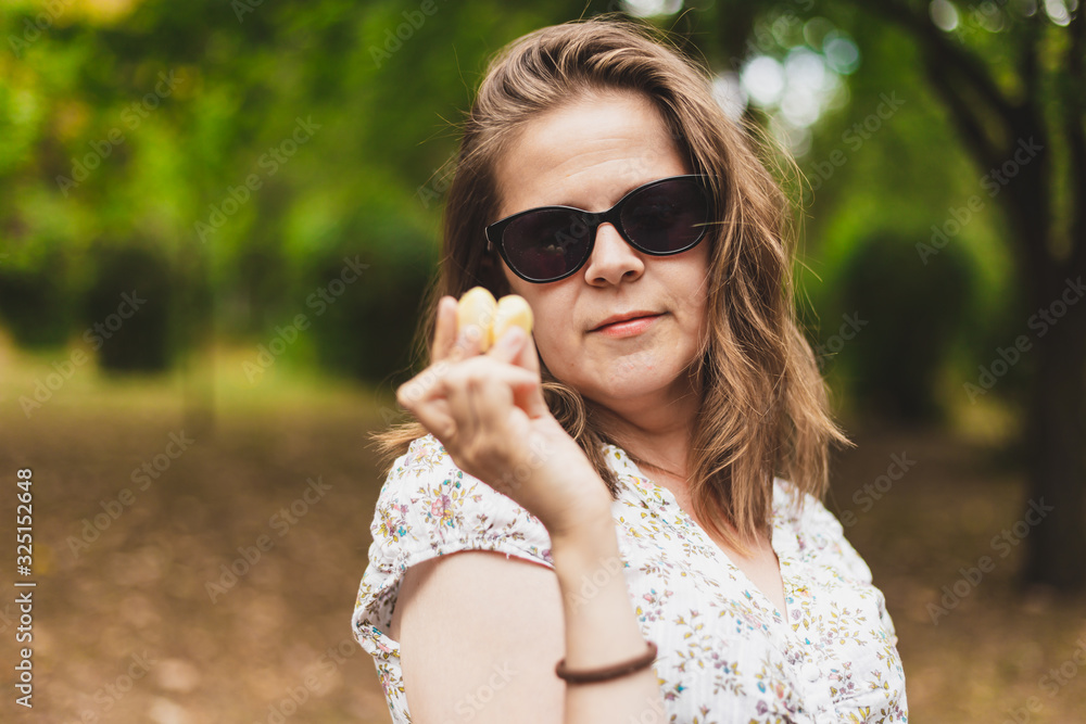Woman holding a garlic clove Woman holding a garlic clove