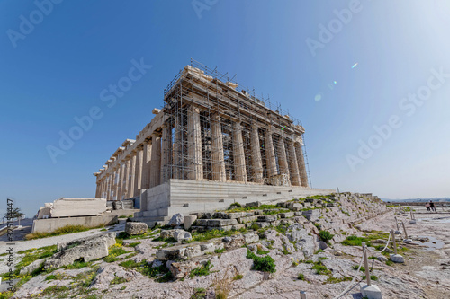 Parthenon the famous ancient Greek temple standing on Acropolis of Athens hill, impressive lens flare