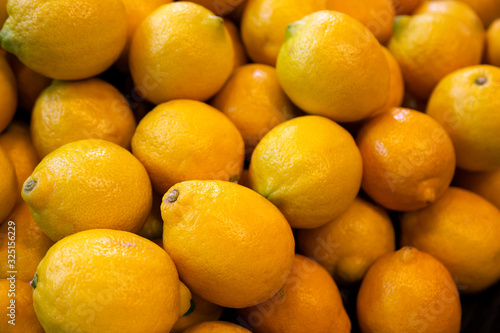 Lemons a yellow  oval citrus fruit with thick skin and fragrant  acidic juice.