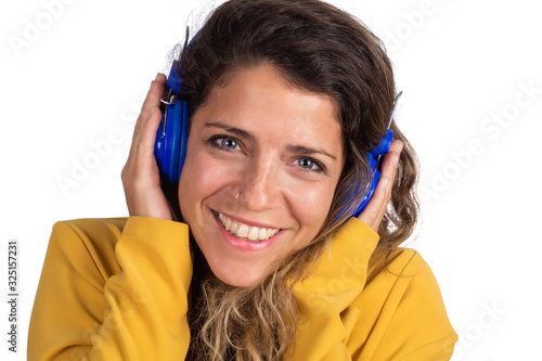 Yoman listening to music with blue headphones. photo