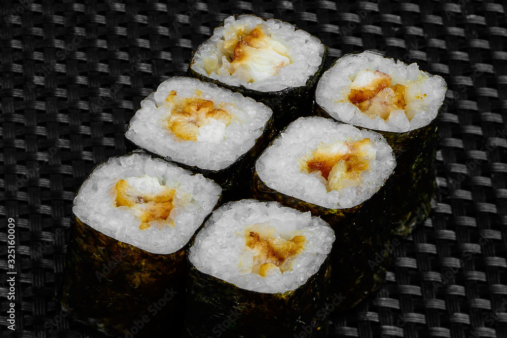 Japanese rolls on a dark textured background Japanese rolls on a dark textured background