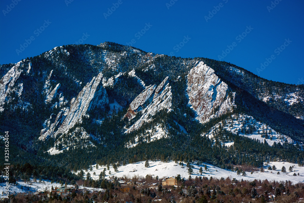 The Flatirons Mountains in Boulder, Colorado on a Snowy Winter Day