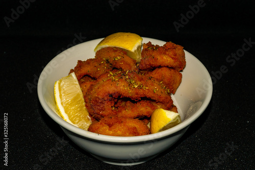 Fried squid with lemon slices