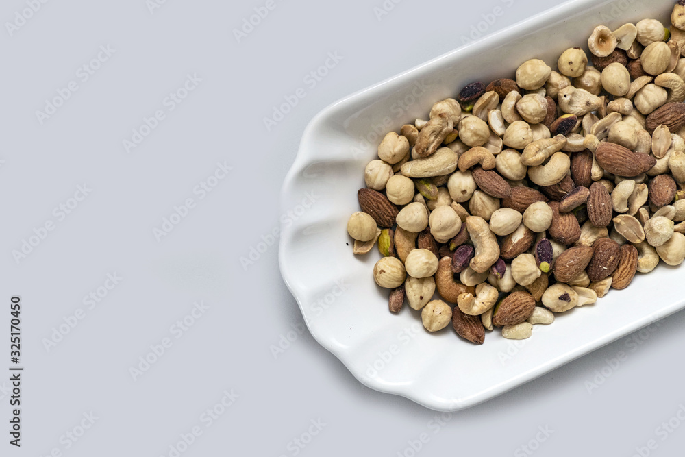 roasted hazelnuts, almonds and cashews in the same dish, roasted hazelnuts, almonds and cashews in the same dish,