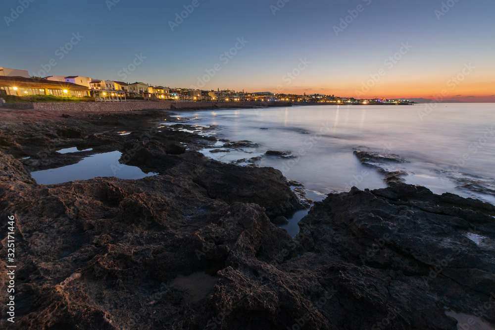 Panoramic view on the beach in Crete in the evening. Long exposure.