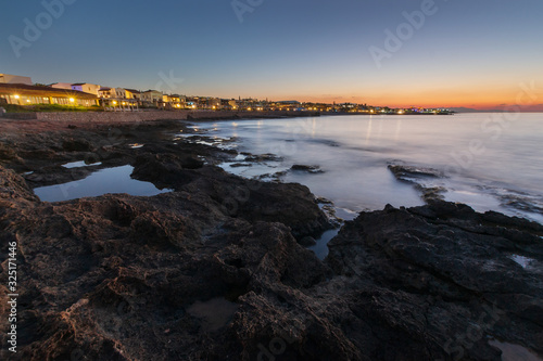 Panoramic view on the beach in Crete in the evening. Long exposure.