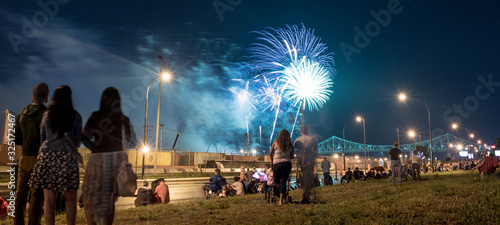 people watching fireworks. Jacques Cartier bridge with fireworks. Montreal Fireworks.
