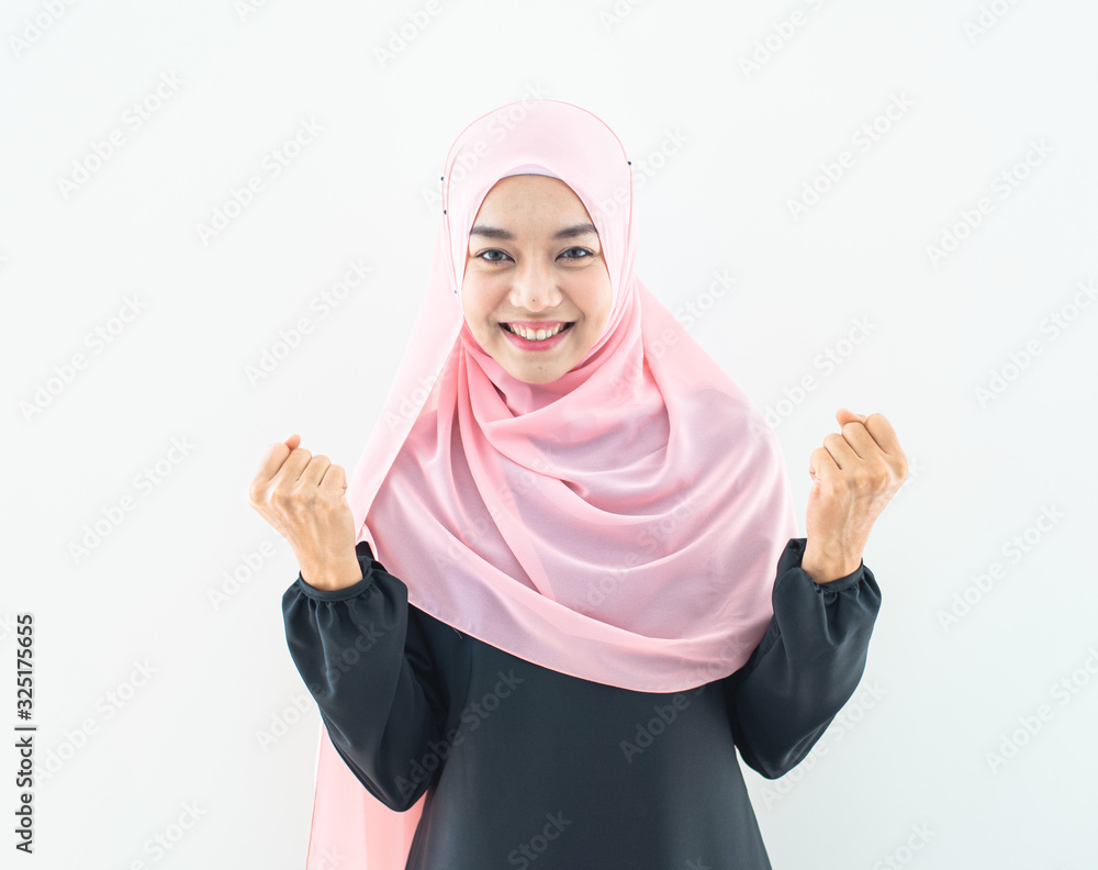 Beautiful female Muslim model in modern kurung and hijab, a modern lifestyle apparel for Muslim women isolated on white background. Beauty and hijab fashion concept. Half length portrait Beautiful female Muslim model in modern kurung and hijab, a modern lifestyle apparel for Muslim women isolated on white background. Beauty and hijab fashion concept. Half length portrait