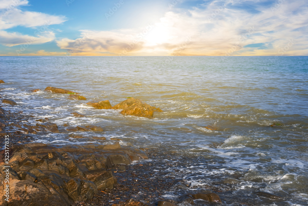 sea bay with stones near a coast at the sunset, vacation outdoor scene sea bay with stones near a coast at the sunset, vacation outdoor scene