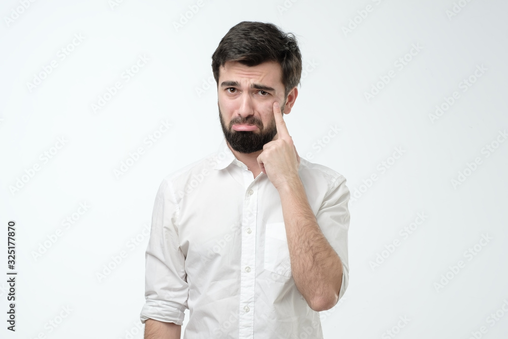 Sad young hispanic man is about to cry. Negative facial human emotion. Sad young hispanic man is about to cry. Negative facial human emotion.