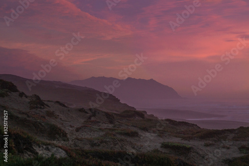 Mountain Rising out of the sea at sunset