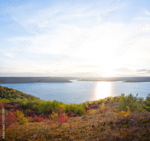 quiet sunset over the river, view from high coast to water