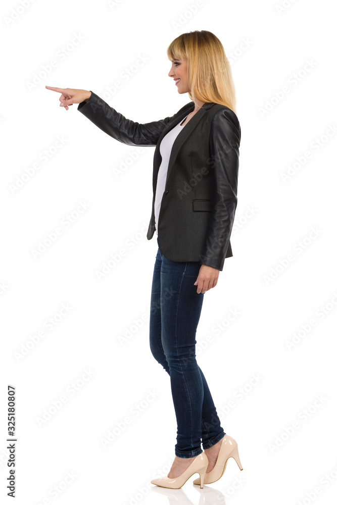 Smiling Young Woman Is Touching Something With Finger Smiling Young Woman Is Touching Something With Finger