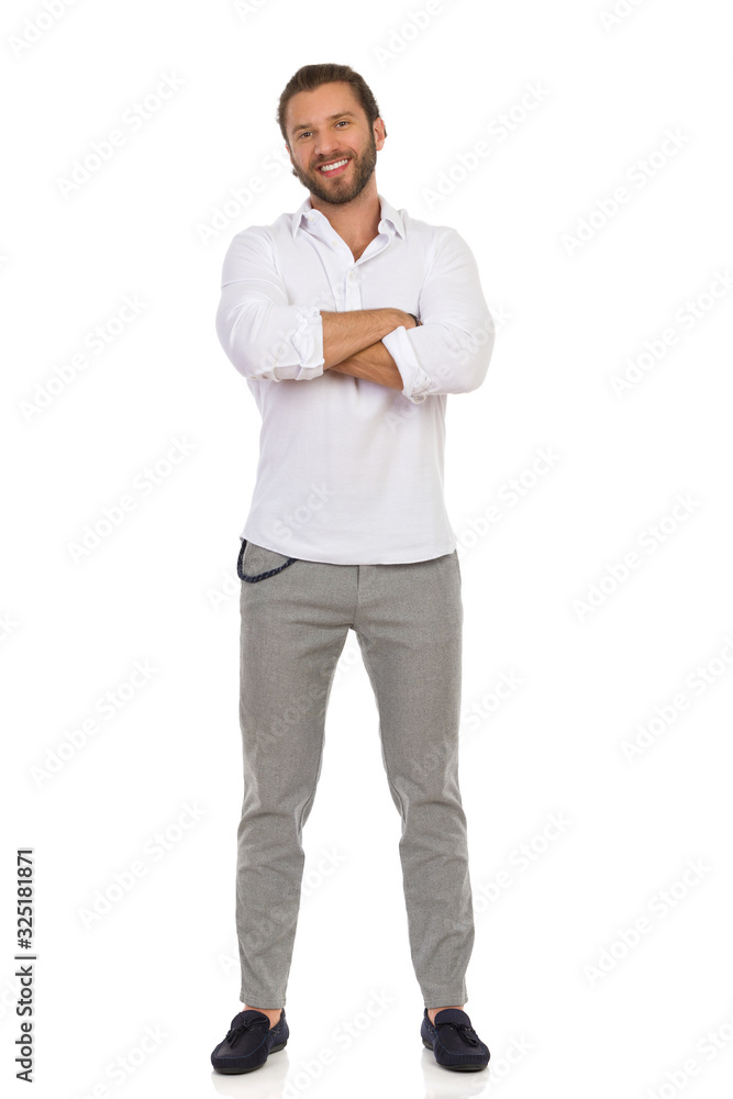 Handsome Man Standing With Arms Crossed. Front View. Handsome Man Standing With Arms Crossed. Front View.