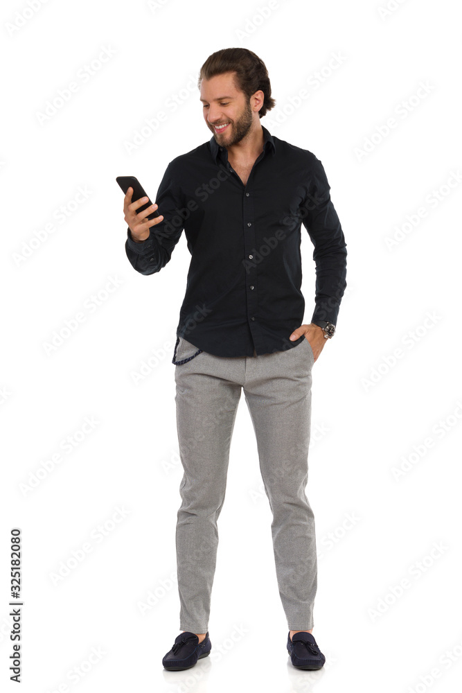 Handsome Man In Black Shirt Is Checking Message At Telephone Handsome Man In Black Shirt Is Checking Message At Telephone