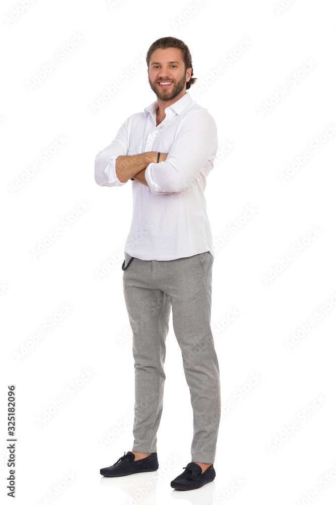 Smiling Standing Man With Arms Crossed. Front Side View. Smiling Standing Man With Arms Crossed. Front Side View.