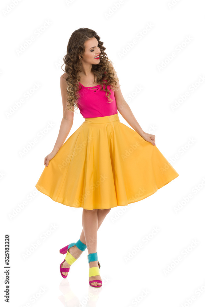 Cheerful Woman Is Presenting Her Yellow Circle Cut Skirt.