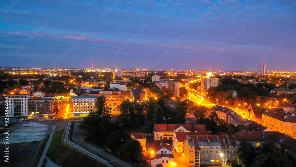 Beautiful panoramic Aerial view photo from flying drone on Klaipeda city center at night.(series)