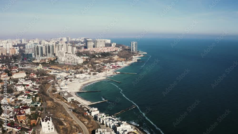 Aerial view of sea coast line near the city buildings Aerial view of sea coast line near the city buildings