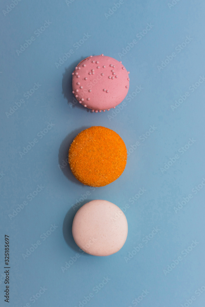 Three multi-colored macaroon on flat background Three multi-colored macaroon on flat background