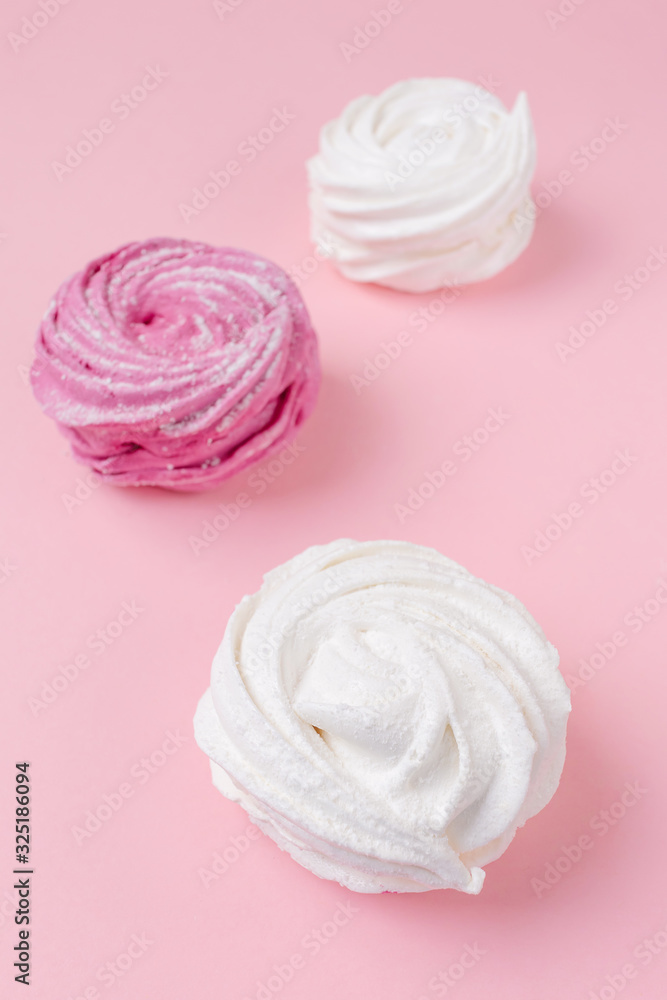 Fresh vanilla and berry marshmallows on a pastel pink background. The concept of home-cooked food, sweets. Minimalism, top view, flat lay, copyspace. Fresh vanilla and berry marshmallows on a pastel pink background. The concept of home-cooked food, sweets. Minimalism, top view, flat lay, copyspace.