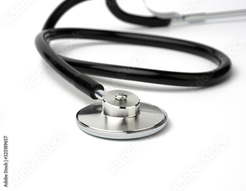 black metal medical stethoscope on a white background