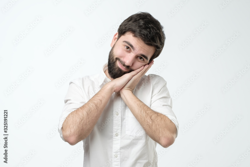 man sleeping tired dreaming and posing with hands together smiling man sleeping tired dreaming and posing with hands together smiling