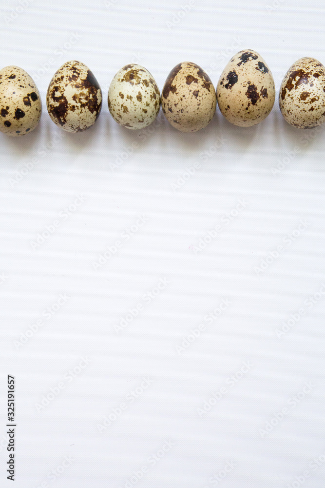 Fototapeta premium quail eggs on a white background. Easter and easter decoration