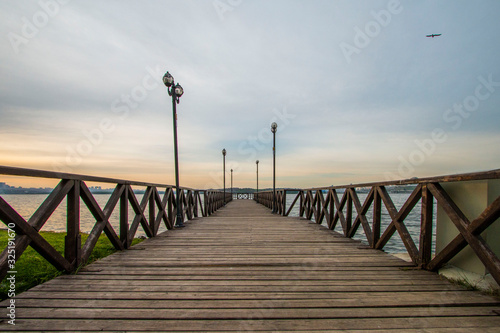 Romantic wooden walkway on the lake