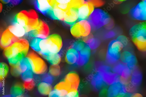 Delicate glitter bokeh rainbow background. Creative and moody color of the picture.