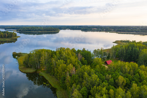 Fototapeta Naklejka Na Ścianę i Meble -  To Aglona small town and beautiful Latgale lakes in summer. Reflection on the lake gorgeous clouds and sky. Aglona, Latgale, Latvia (series)