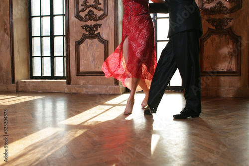 Beautiful woman in red dress dancing Argentinian tango 