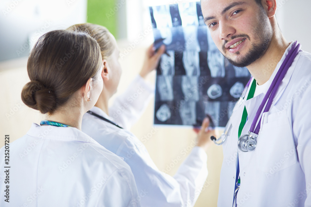 Medical doctors analysing x-ray photography in hospital Medical doctors analysing x-ray photography in hospital