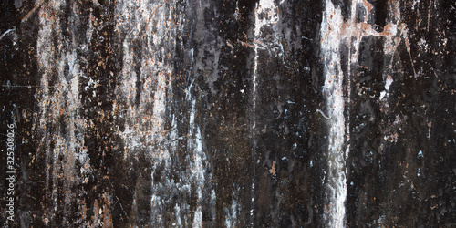 Grunge metal background and rust texture. Panoramic texture of old dark dirty iron panel damaged corrosion. 