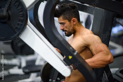 Handsome Muscular Men Workout at the Gym